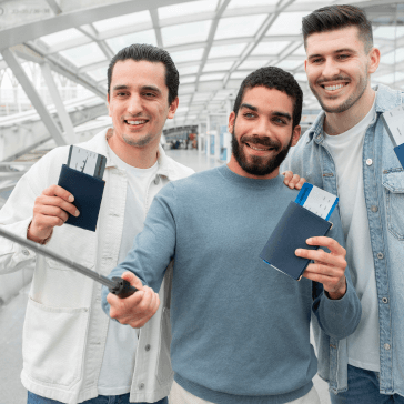 three-tourists-men-making-selfie-showing-boarding-2023-11-27-04-56-28-utc 1